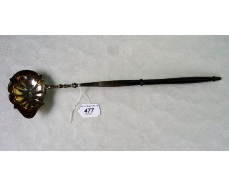A mid-18th century silver ladle of shaped form, George Burrows, London 1750, having a turned wooden handle (39cm).
