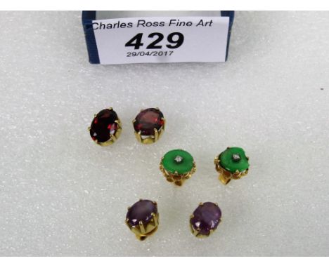 A pair of single stone garnet earrings, oval cut to simple claw mounts, a pair of jade and diamond earrings and one further p