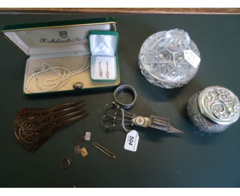 A mixed lot to include a pair of candle snuffers, a silver napkin ring, a faux tortoiseshell hair slide, a pair of 9ct earrin