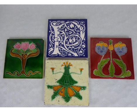 A late 19th century T & R Boote tile, having Art Nouveau tube-lined decoration, together with two further similar tiles and a