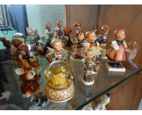 A collection of ten Goebel/Hummel figurines, to include: examples numbered 89, 13, 66 and others.