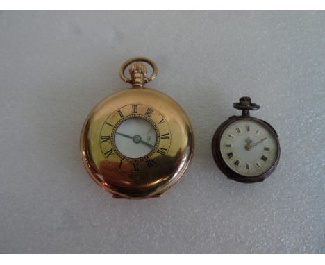 A gentleman's 9ct gold half hunting cased watch; with enamelled chapter ring, white enamel dial, Roman numerals and subsidiar