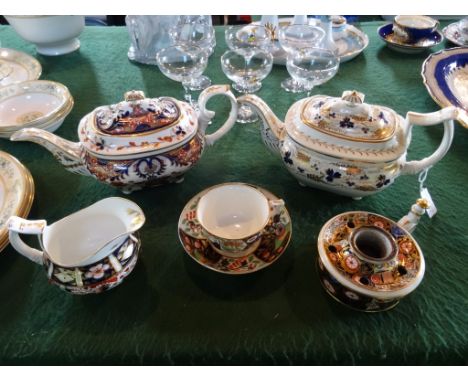 A Crown Derby Imari pattern teapot, red painted mark to base, together with a conforming milk jug, teacup and saucer, taper s