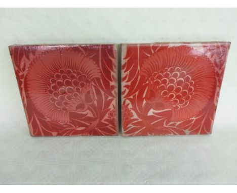 A pair of William de Morgan ruby lustre tiles, featuring a version of the BBB pattern, having an oval de Morgan Fulham stamp 