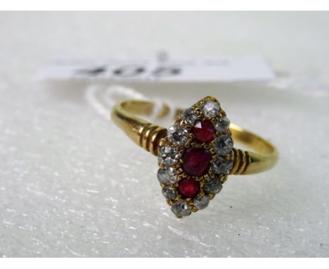 A Victorian ruby and diamond marquise-shaped cluster ring, set with three rubies within a border of old cut diamonds.   Condi