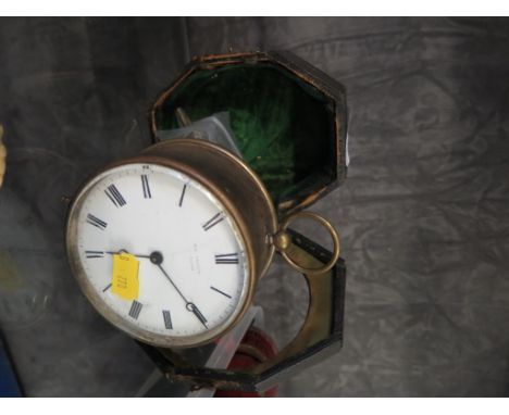 A brass circular table clock, the enamel dial inscribed George Blackie, Strand, the single train balance wheel movement stamp