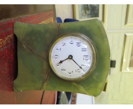 A 1920s Onyx table clock, with enamel dial and single train balance wheel movement, 21cm high