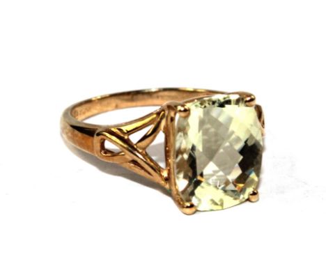 A 9 carat gold ring set with a traditional cut citrine