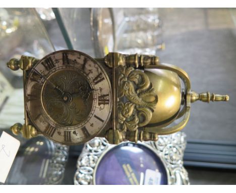 A reproduction brass miniature lantern clock, with jewelled movement, 16cm high