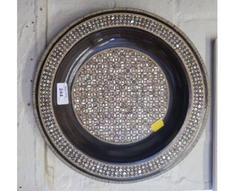 An Egyptian fine traditional Sadeli Cairo inlay wall plate with mother of pearl in an intricate geometric pattern, 31cm diame