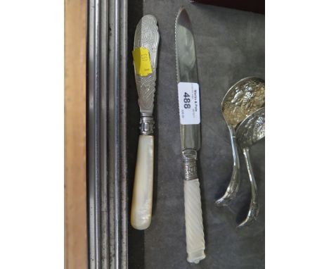 A silver butter knife with mother of pearl handle, Sheffield 1873 and a mother of pearl handled silver plated cake knife