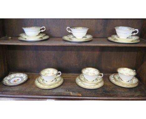 A set of six Paragon china tea cups, saucers and plates, with gilded borders and polychrome floral centres, and an extra sauc