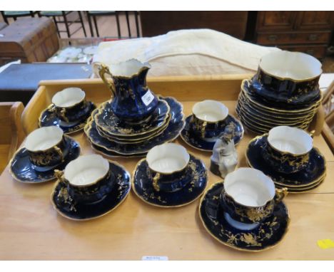 A Limoges underglaze blue and gilt tea service with foliate decoration, M. Redon for Charles Jenner & Co, Edinburgh