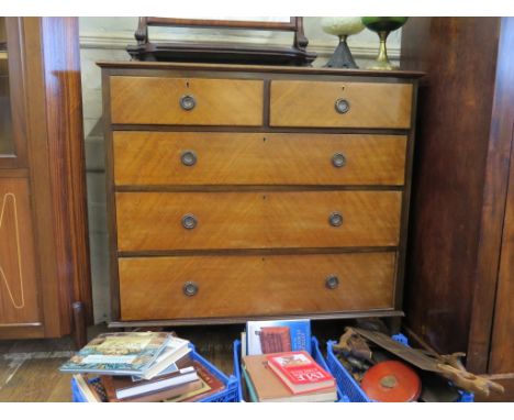 A 1920s mahogany chest of drawers, with two short and three long graduated drawers on open bracket feet, 106cm wide
