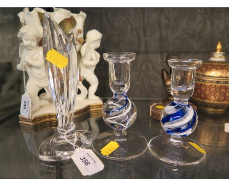 A Waterford Marquis crystal glass candlestick together with a pair of squat blue and white ribbon stemmed candlesticks