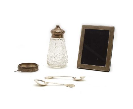 A collection of silver items, to include a hinged bangle, Birmingham 1969, a silver photograph frame, London 2004, aperture 1