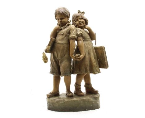 Friedrich Goldschneider (Austrian,1845-1897)'Musique', a polychrome cold painted terracotta figure group of a boy and a girl 