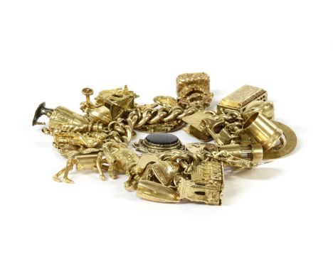 A 9ct gold charm bracelet, a 9ct gold curb link bracelet with heart shaped padlock clasp, suspending twenty four gold charms,