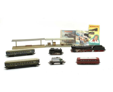 An extensive Marklin 00 gauge 3-rail electric railway,  to include; a DA800 4-6-2 tender engine, four sleeping car coaches, a