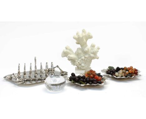 Interior design items, comprising a chrome 'snaffle' tray, a chrome toast rack, two leaf dishes with faux fruit, a tea light 