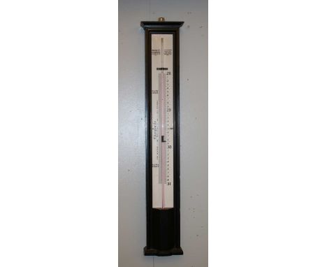 A Negretti & Zambra stick barometer, the two section white enamel dial housed in an ebonised mahogany case, 103cm highConditi