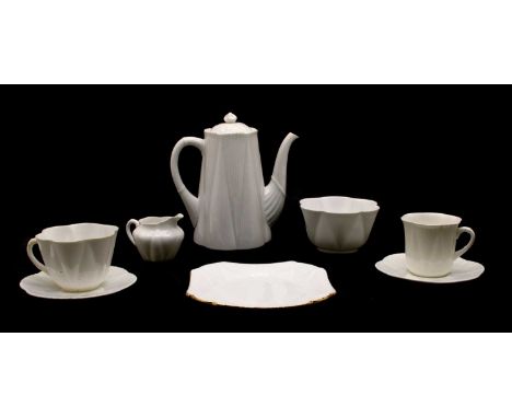 A Shelley white porcelain part tea set, comprising of tea pot, three tea cups, four teacup saucers, five coffee cans, four co