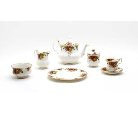 A collection of Royal Albert Old Country Roses, comprising teapot, various teacups and saucers, a variety of plates, two grad