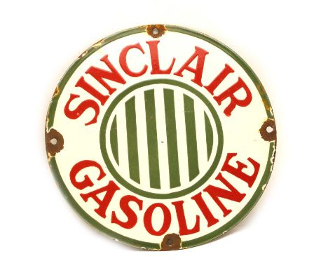 An enamel sign 'Sinclair Gasoline', 30.5cm diameterCondition report: Rusty holes and rusty chipped edges in places