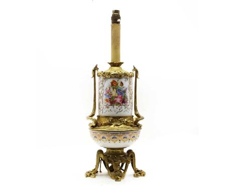 A Continental porcelain and gilt metal table lamp, with coloured, printed, decoration, 57cm highCondition report: Not guarant