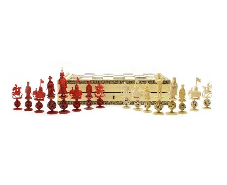 A Canton ivory puzzleball chess set, mid 19th century, the white King and Queen representing Napoleon Bonaparte and Josephine