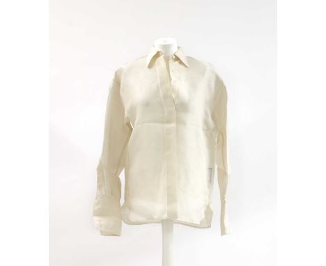 A Ralph Lauren cream long sleeved silk blouse, size 6, and a Ralph Lauren cream blouse, with cap sleeve and button front size