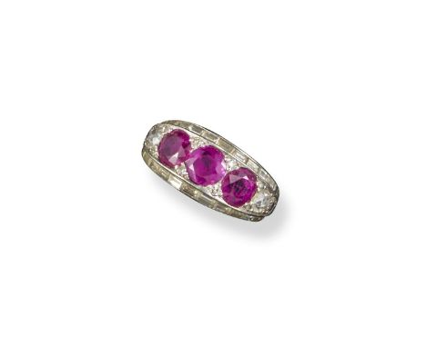A ruby and diamond bombe-shaped ring, the three circular-cut rubies pave-set within old cut diamonds and a border of baguette
