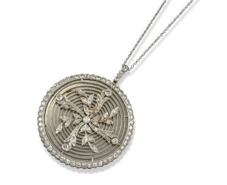 An Edwardian diamond-set portrait pendant, the portrait of a girl is set within millegrain-set diamond border. The reverse su