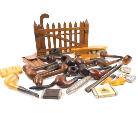 A large quantity of pipes, accessories and a pipe rack modelled in the form of an oak gate.