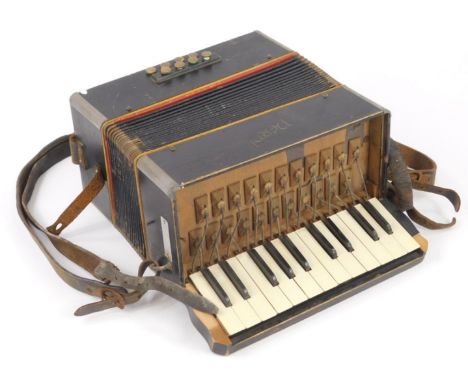 A piano accordion, in ebonised case, name indistinct with leather straps.