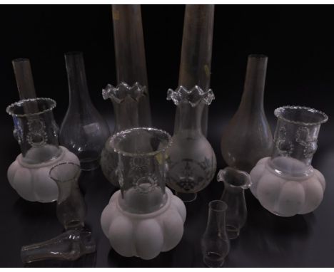 A quantity of oil lamp chimneys, shades etc.
