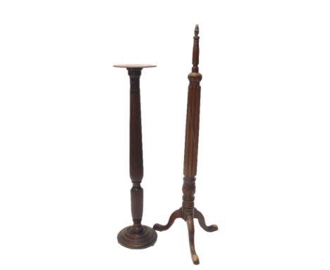 A mahogany torchere, with a later top, on a stepped base, 128cm high, and a similar standard lamp, both probably constructed 