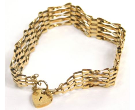 A 9ct gold gate bracelet, with five bar design, and small padlock, 8.7g all in. 