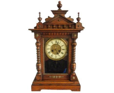 A Vienna type walnut mantel clock, with turned finials, 54cm H.