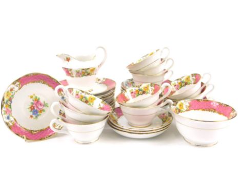 A late 19th/early 20thC part tea service,  printed with flowers within a pink scale ground, unmarked.