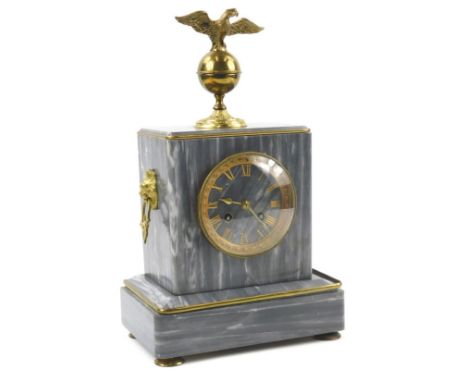 A French grey marble and gilt metal mantel clock, with an eagle finial, lion mask side handles and gilt Roman numerals on bun