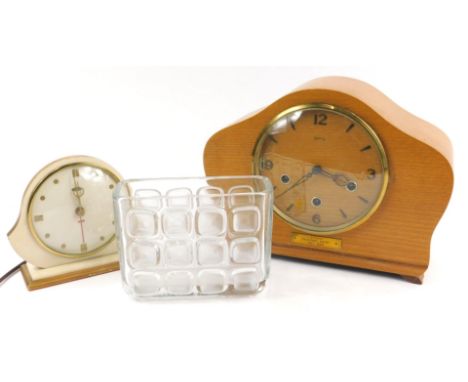 A Smiths presentation mantel clock, in a light oak case, dating from the later part of the 1950s, a Metomic electric mantel c