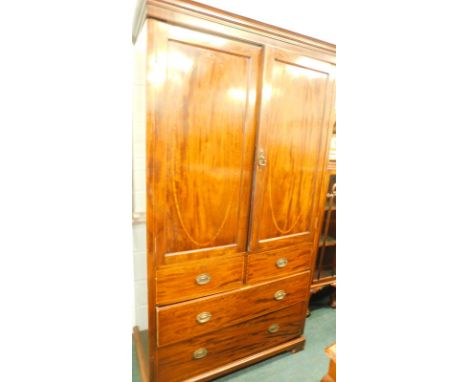 An Edwardian mahogany and satinwood banded clothes press, the two panelled doors enclosing a later brass rail, the base with 