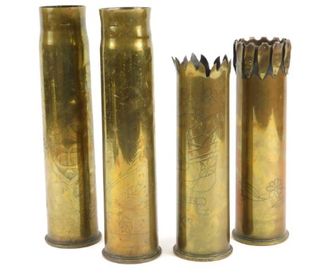 Four engraved Trench Art artillery shells, to include an example with a petallated border, the shells themselves First World 