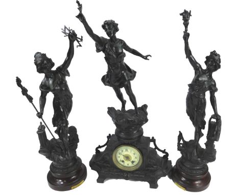A late 19thC French spelter clock garniture, with central female figure, mounted onto a mantel clock with Arabic numerals, 66