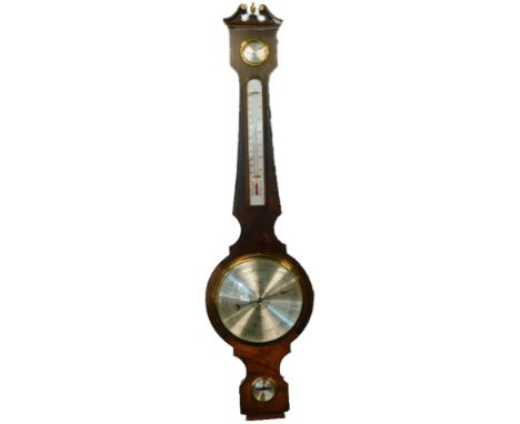A wheel barometer in mid 19thC style by Comitti of Holborn, the mahogany case with a swan neck pediment, dry damp gauge, ther