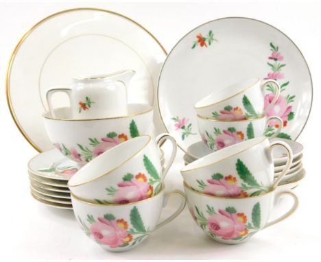A K.P.M Berlin porcelain part tea service, later decorated with flowers etc., printed mark to underside.