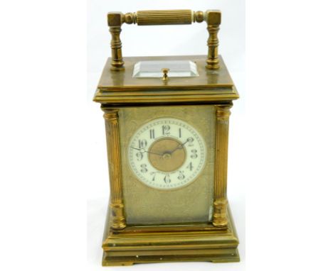 A 19thC gilt brass cased carriage clock, the circular white chapter ring signed Walters and George 170 Regents Circus, the fa