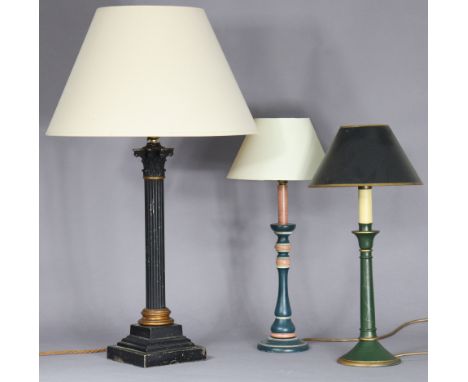 An early 20th century ebonised Corinthian column table lamp, cm high; &amp; two modern turned wooden table lamps.