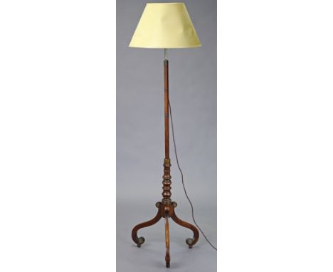 A Regency mahogany standard lamp converted from a pole screen, with turned column and three scroll legs, 135cm high.